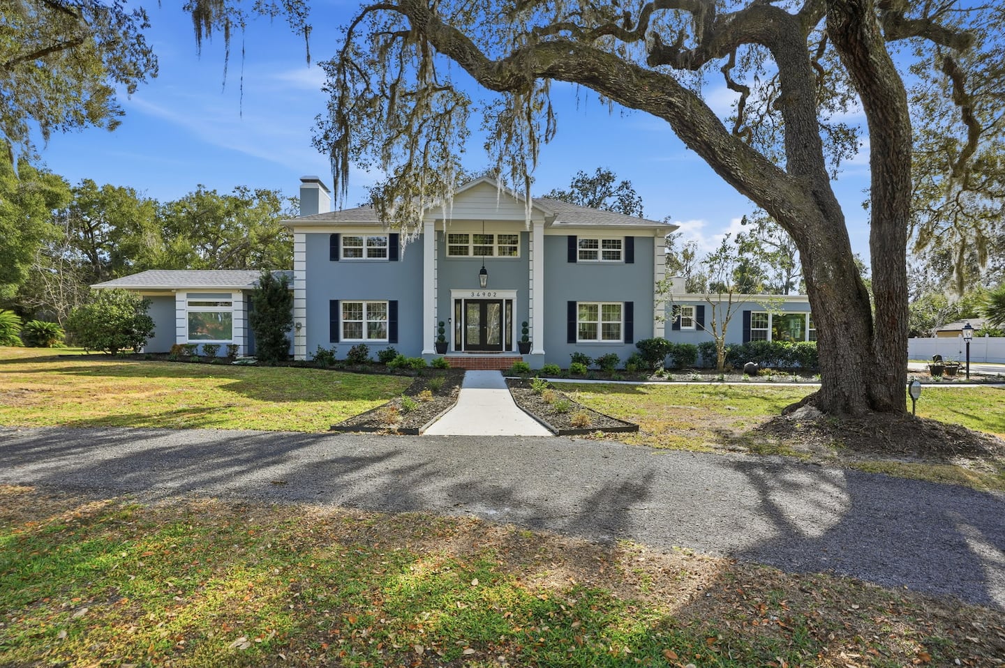 The estate house, framed by the oaks — Lakeview Estate